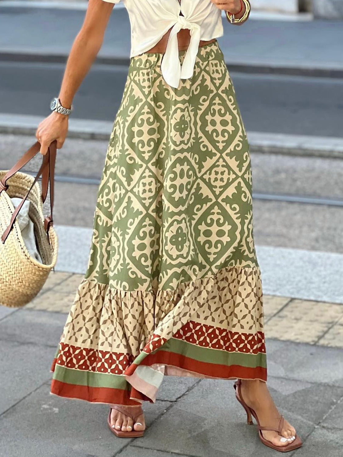 Tiered maxi skirt in green medallion print with ruffled hem and bohemian style