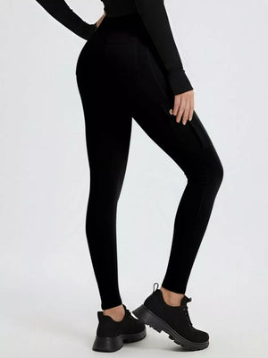 Black maternity active pants with cargo pockets and a high waist.