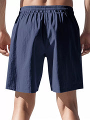 Navy blue chino shorts with elastic drawstring waist and relaxed fit.