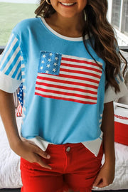 Patriotic patchwork t-shirt with American flag pocket and striped sleeves.