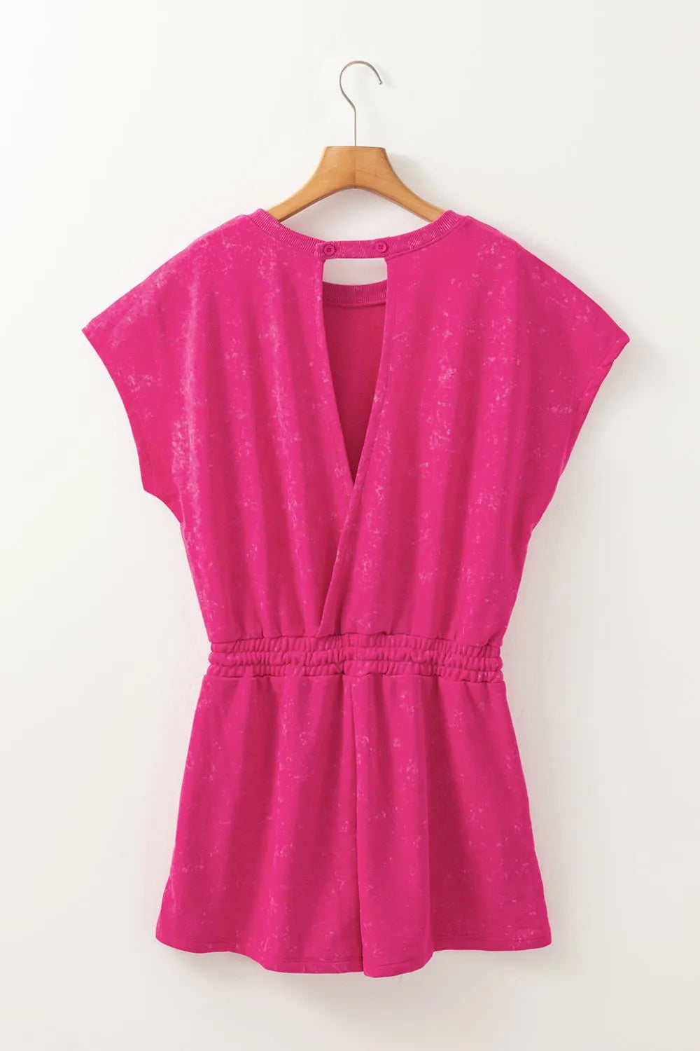 Hot pink acid wash tee with back cutout and elastic waist shorts.