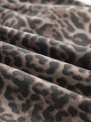 Leopard print V-neck denim top with a textured fabric detail