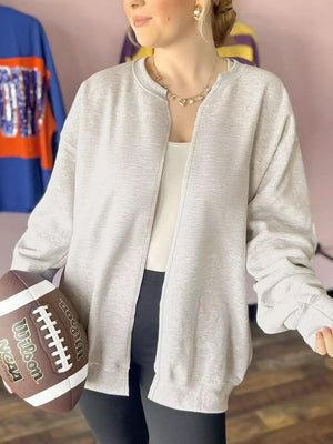 50% polyester, 43% viscose, 7% elastane Care instructions: Machine wash cold zip-up sweater in Light Gray with relaxed