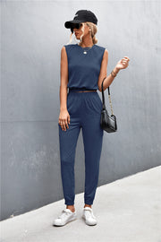 Navy cropped muscle tank and jogger set with elastic waistband and cuffs.