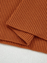 Caramel ribbed knit sweater with drop shoulder detail.
