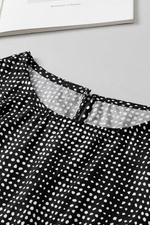 Black dotted blouse with a square neckline and keyhole detail