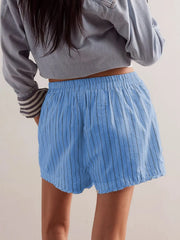 Light blue pinstripe boxer shorts with elastic waistband and raw hem