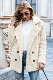 Cream teddy pea coat with double-breasted closure and notched lapels.