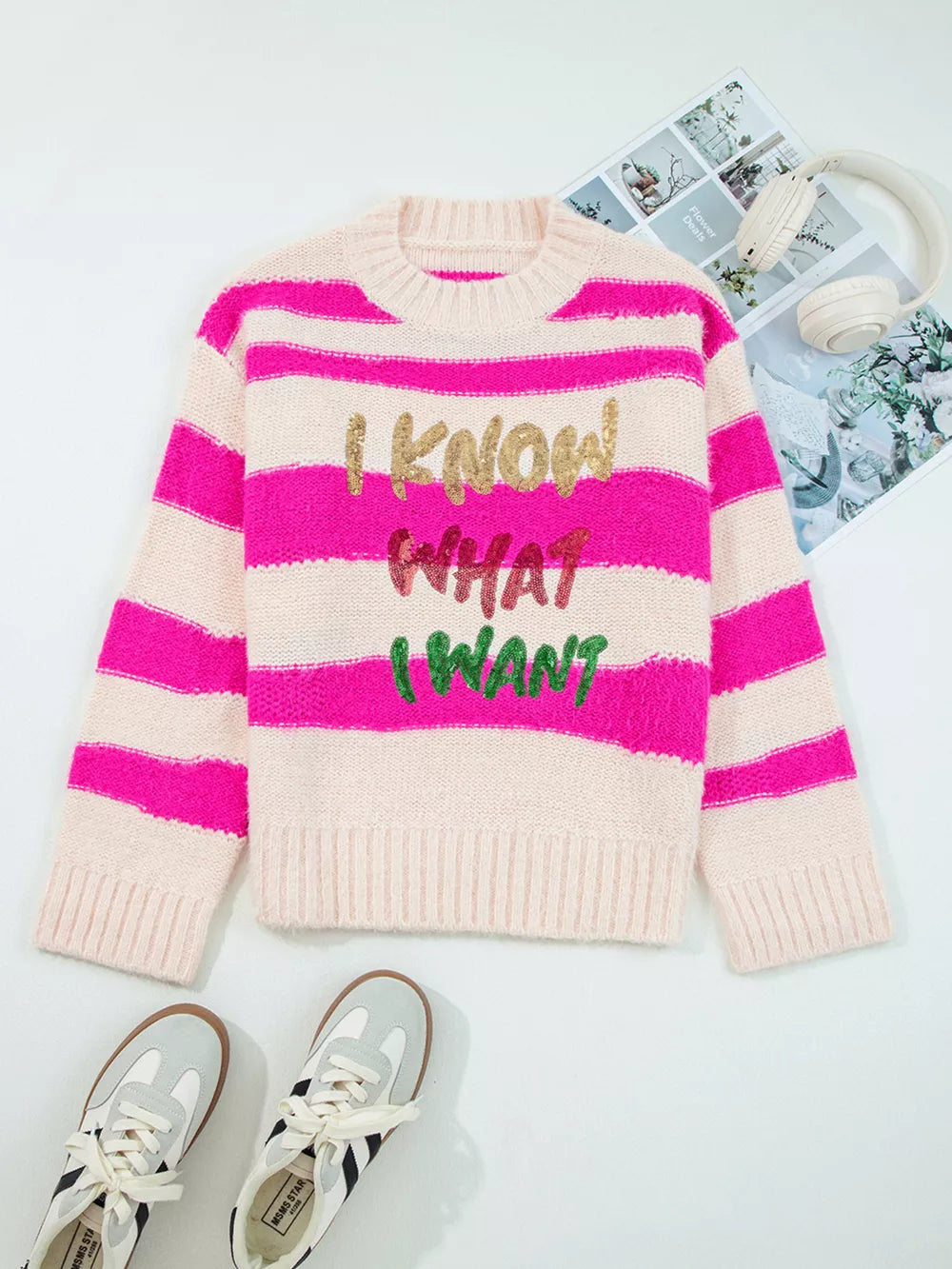 Bold sequin graphic colorblock knit sweater with crew neck and pink stripes.