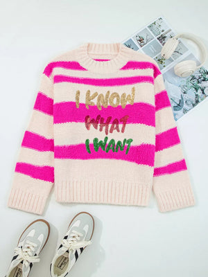Bold sequin graphic colorblock knit sweater with crew neck and pink stripes.