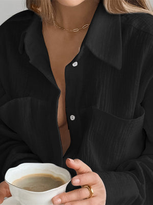 Black textured cotton button-up lounge shirt with chest pocket and collar.