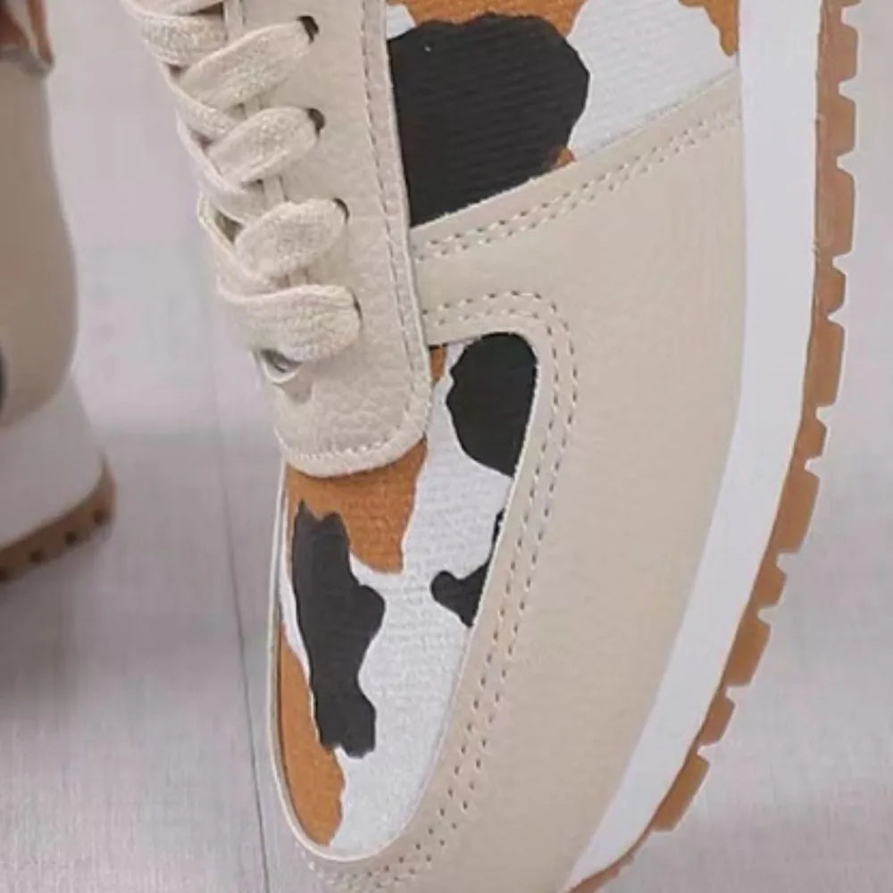 Runner sneakers with leopard print panels and lace-up closure in beige.
