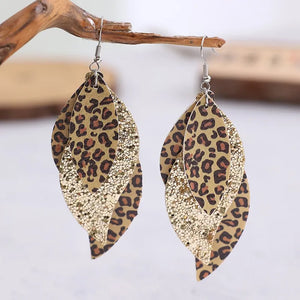 Leopard print layered drop earrings with gold glitter accents.