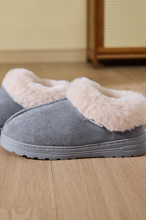 Gray suede house slippers with plush faux fur trim.