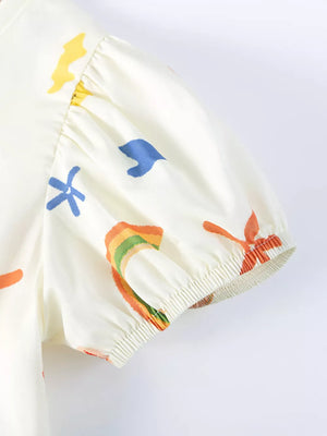 Baby dress with playful abstract print, short puff sleeves, and elastic cuffs.
