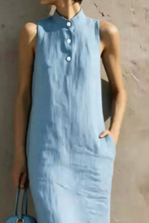 Light blue sleeveless midi dress with button accents and pockets.