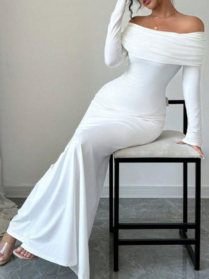 White off-shoulder bodycon maxi dress with draped neckline and long sleeves.