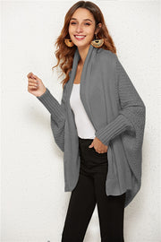 Light gray cocoon knit cardigan with shawl collar and batwing sleeves.