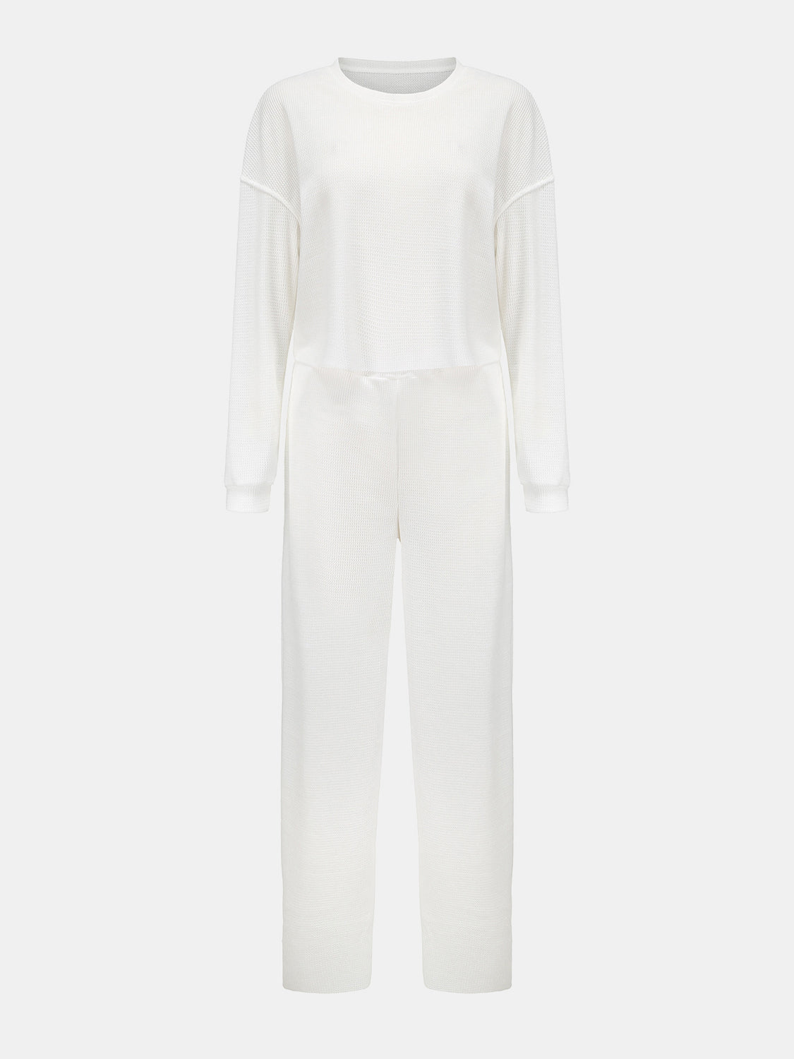 White waffle knit cropped lounge set with long sleeves and wide-leg pants.