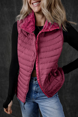 Deep Purple quilted puffer vest with a fuzzy fleece collar and zipper front.