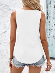 White eyelet tank top with crisscross detail, casual sleeveless cut.