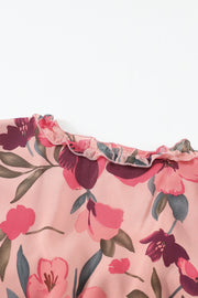 Floral ruffle maxi dress in pink with a tiered skirt and floral pattern.