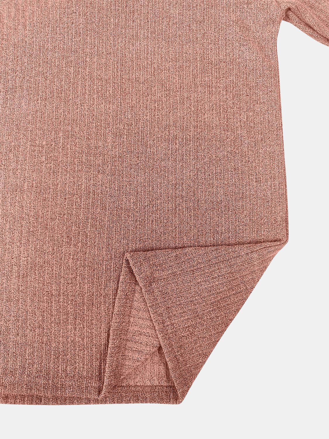 Ribbed knit pullover in burnt coral with side slit detail.