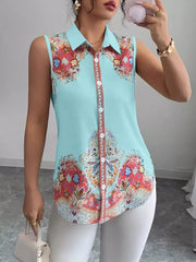Sleeveless collared shirt in blue with vibrant paisley print and button front.