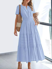 Light blue ruched V-neck tiered midi dress with short sleeves and pockets.