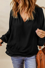 Black ruched cuff voluminous sleeve blouse with V-neck.