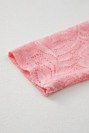 Dusty pink lace blouse with a floral pattern and second-skin fit.