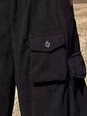 Black ribbed cargo joggers with spacious button-flap pockets.