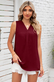 Burgundy sleeveless V-neck blouse with textured fabric and front pleats