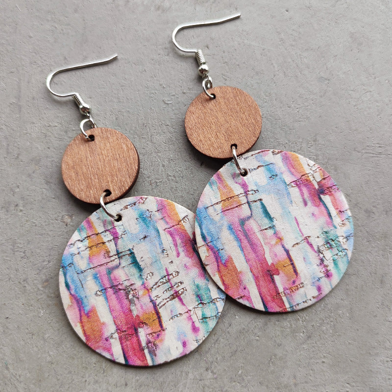 Cork & wood stripe disc earrings with colorful abstract pattern.