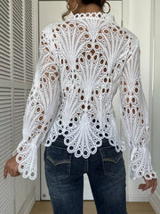 White lace button-up blouse with scalloped collar and bell sleeves, intricate cutout pattern.