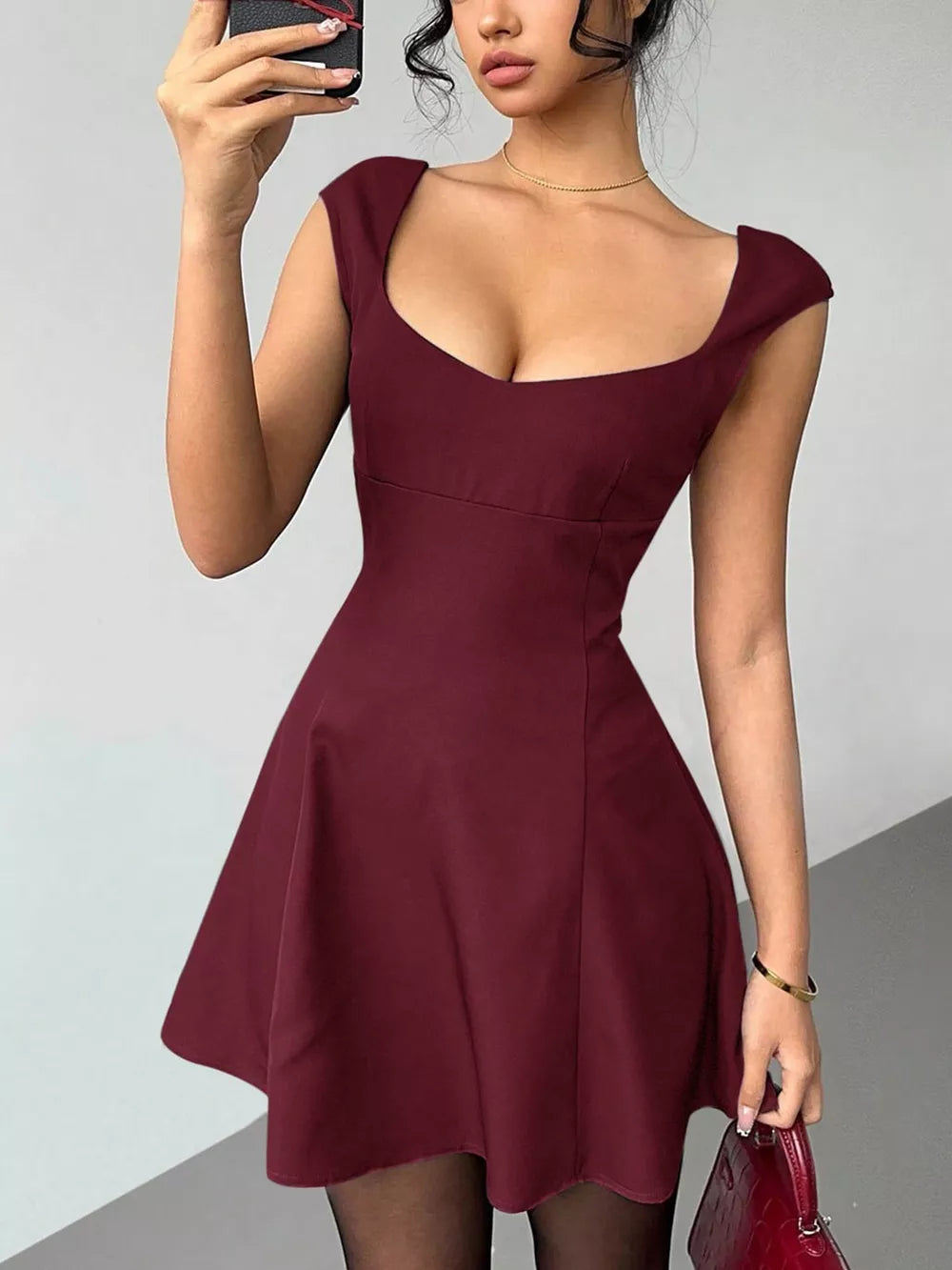 Maroon sweetheart neckline a-line mini dress with cap sleeves.