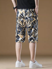 Men's abstract geometric print drawstring chino shorts with cuffed hem.