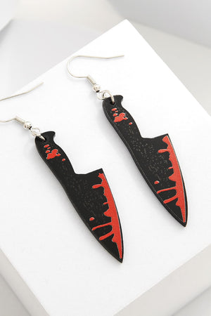 Gory blade drop earrings in black with red blood splatter detail.