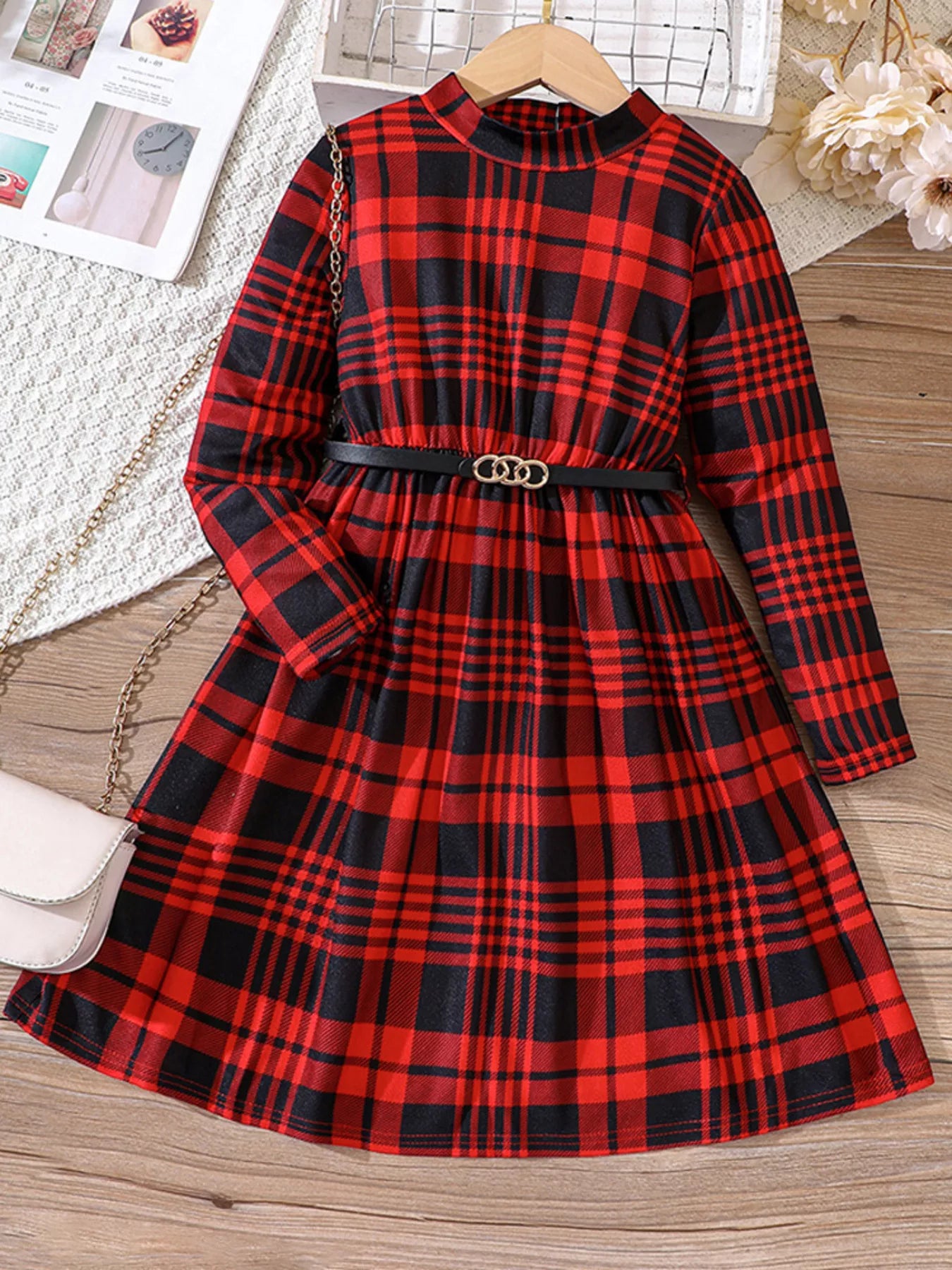 Belted plaid long-sleeve dress in deep red with a mock neck and gold buckle detail.