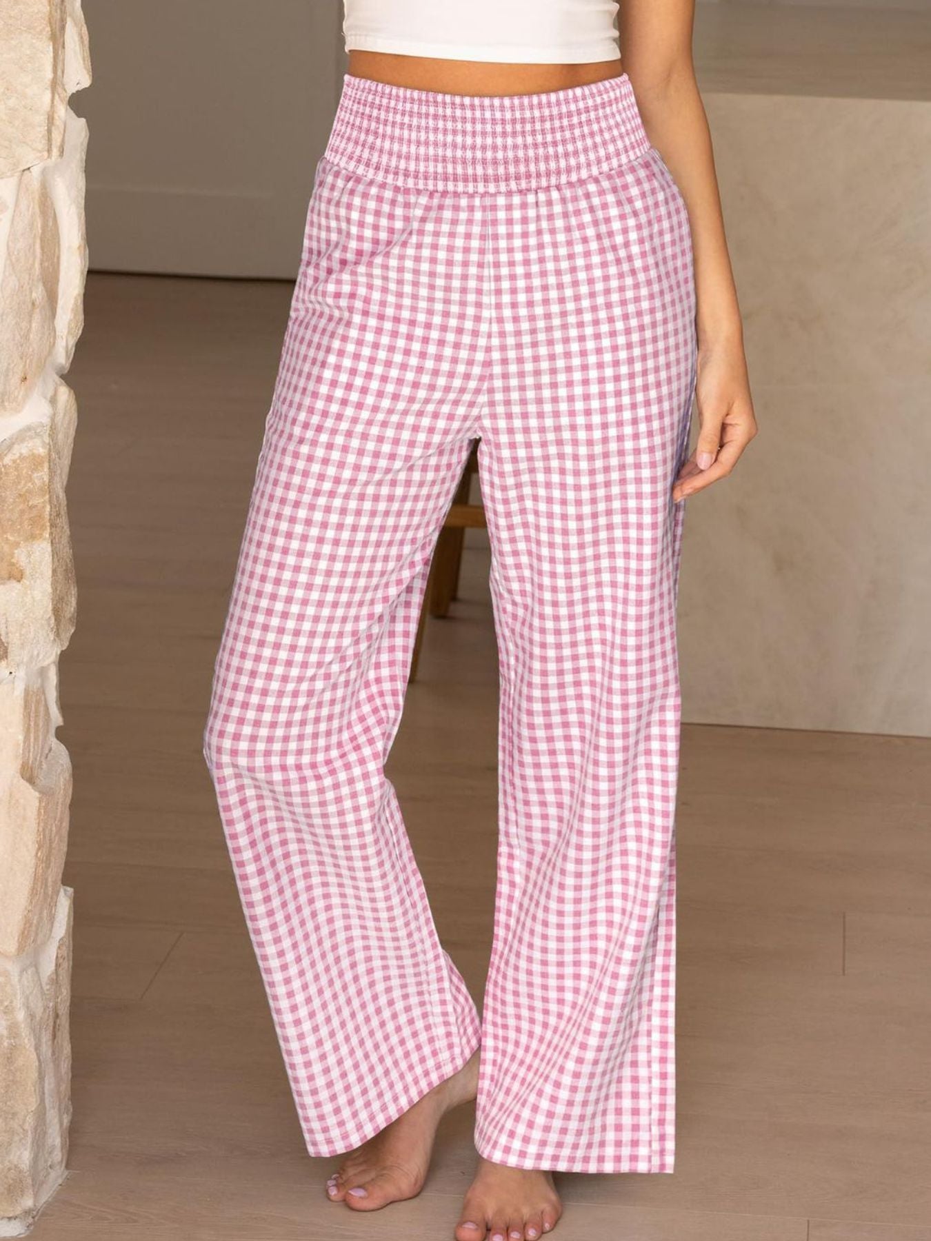 Blush pink gingham smocked high-waist wide-leg pants