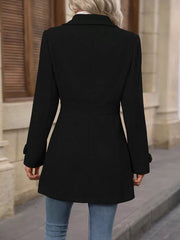 Black button-up trench coat with cinched waist and buttoned cuffs.