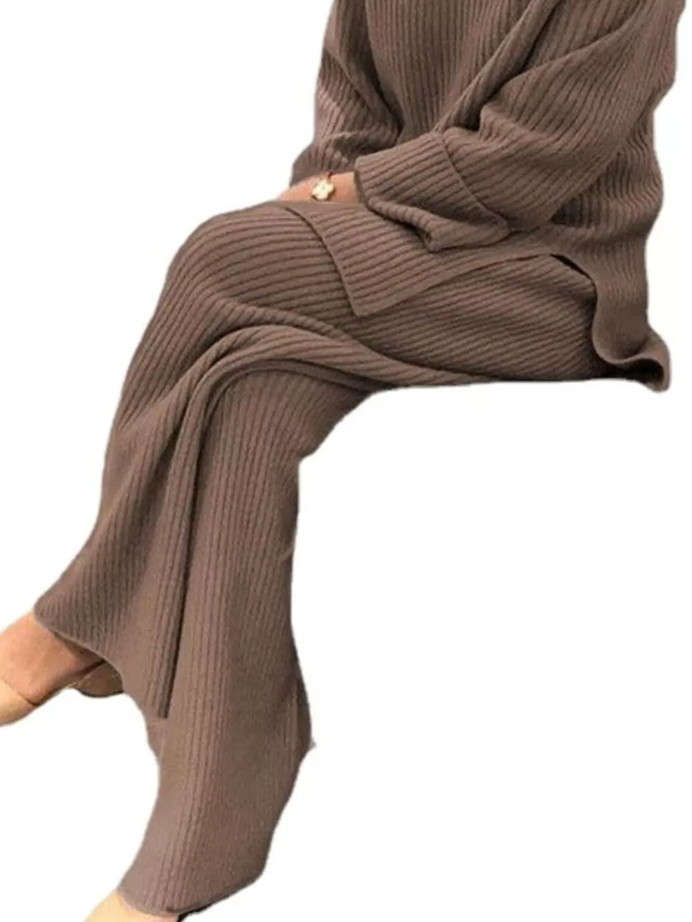Ribbed knit two-piece sweater ensemble in apricot, featuring wide-leg pants and a long-sleeve top.