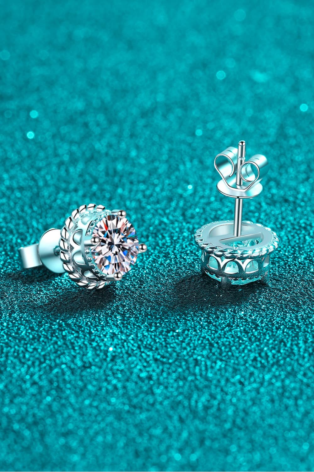 Sterling silver stud earrings with moissanite and rope-like frame detail.