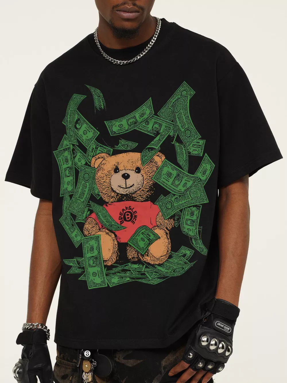 Black cotton blend t-shirt with teddy bear graphic and falling money print.