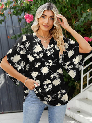 Black floral print blouse with flutter sleeves and V-neck, 100% polyester