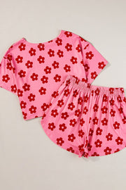 Retro floral crop top and shorts set in coral pink with red flowers.