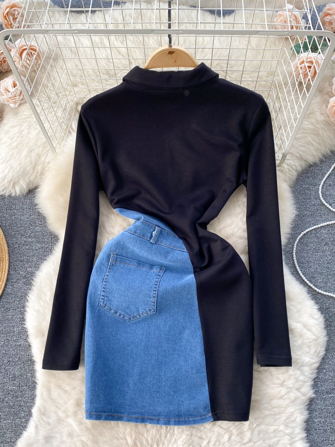 Black long sleeve asymmetrical denim patchwork mini dress with a mock neck and back pocket detail.