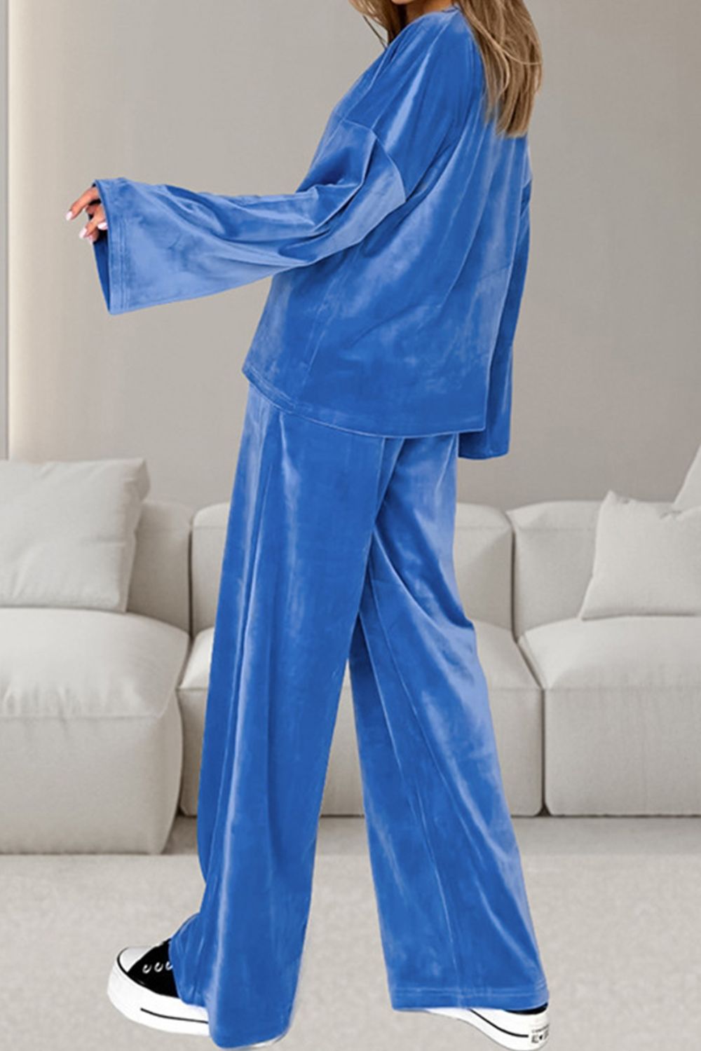 Blue velvet lounge set with wide sleeve top and wide leg pants.