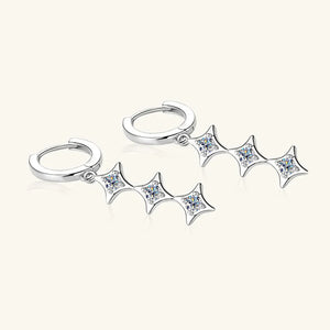 Silver hoop earrings with cascading diamond star charms.