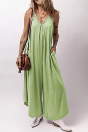 Sleeveless wide-leg romper in light green with V-neck and pockets.